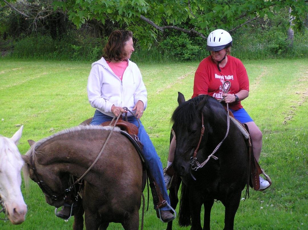 betsy riding on Dave the neighbors horse