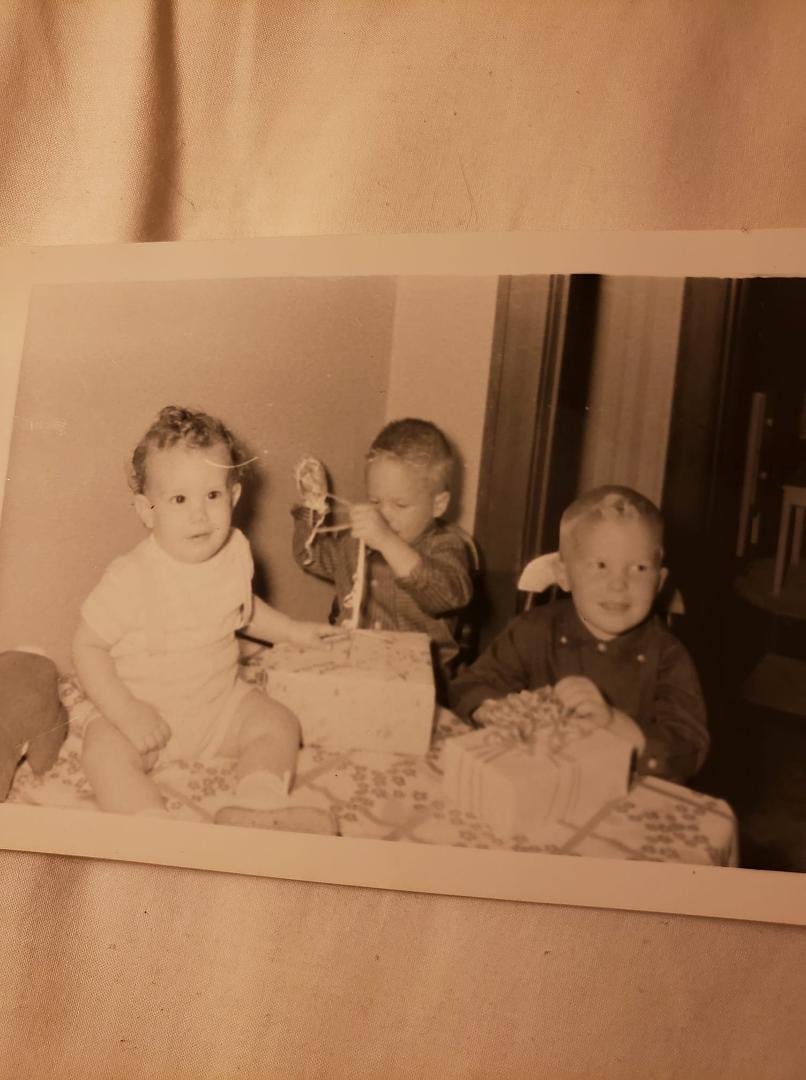 This is me on June 23,1958, my 1st Birthday. Today I'm 64. Yikes! With me are my cousins Mark Reynolds, helping me with my gift , and Mike Reynolds.