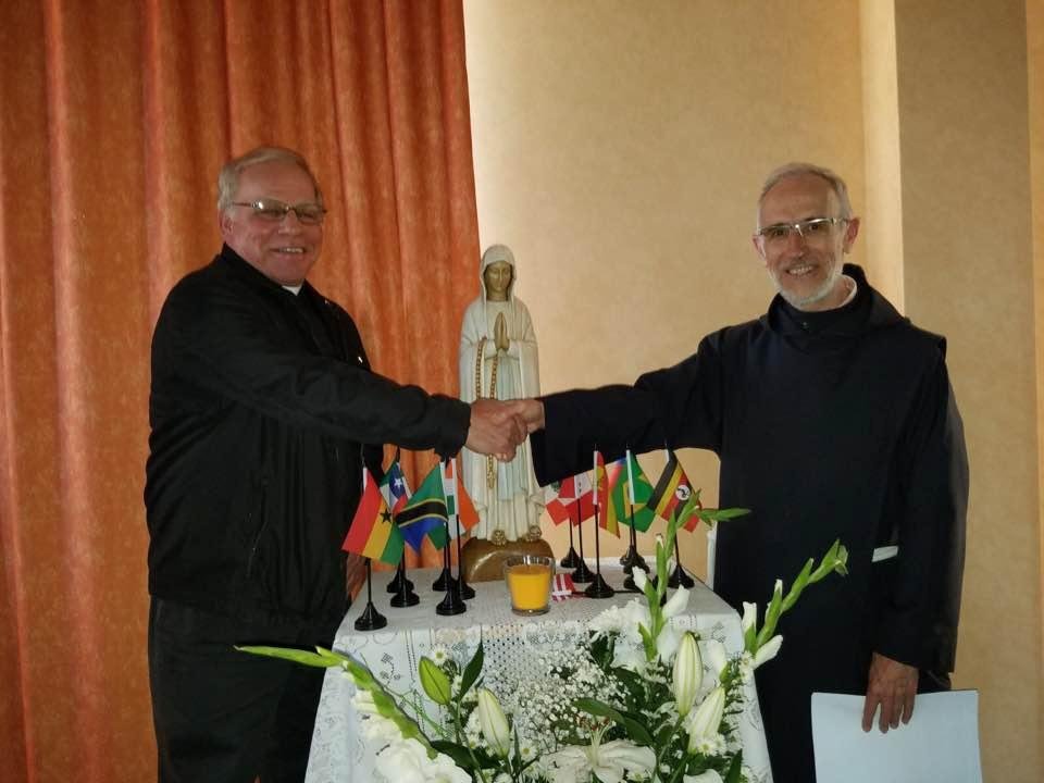 Shaking hands withFather Andre Cabes, Rector of Lourdes Basilica, France.