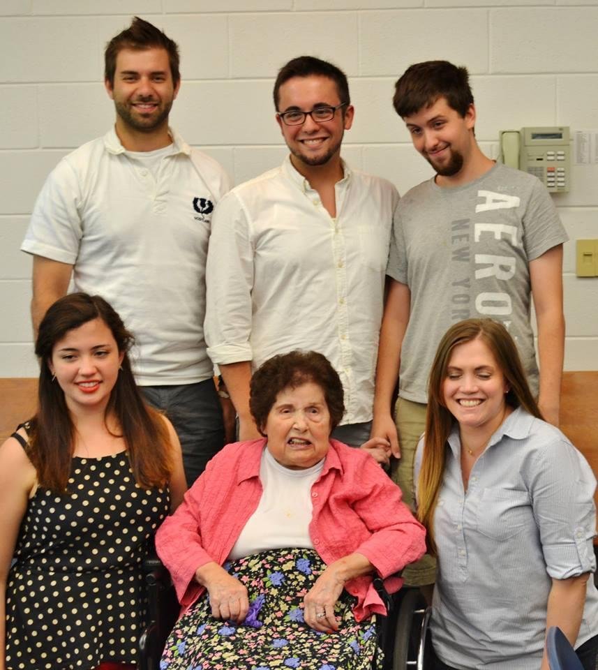 Grandma looks fierce flanked by MaryKate and Ashley, Bryan, Kenny, Andrew in second row.