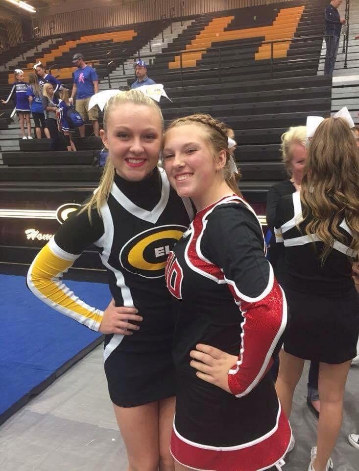 2 beautiful cheerleaders. Both of them are my grandfdaughders.  Different school, different parent.