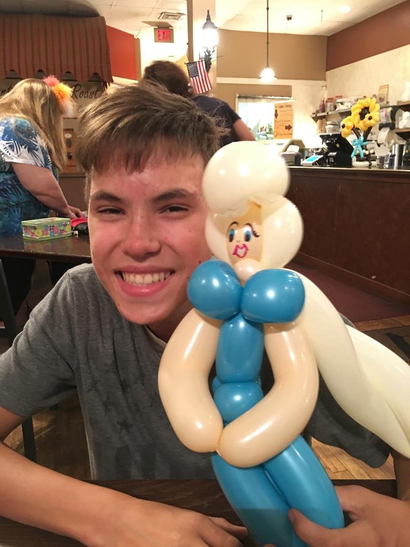 While getting shakes, balloon lady asked boys if they would like one. Nicholas being secure in his maturity & masculinity asked for Elsa. LOL