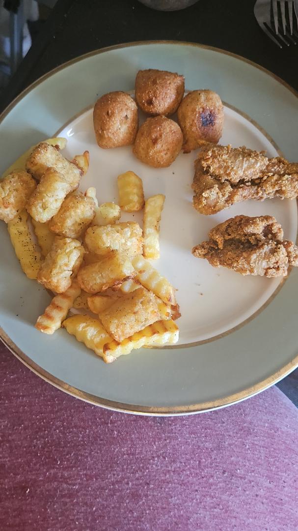 Tonight's dinner, hushpuppies, tater tots, french fries and fried catfish.
