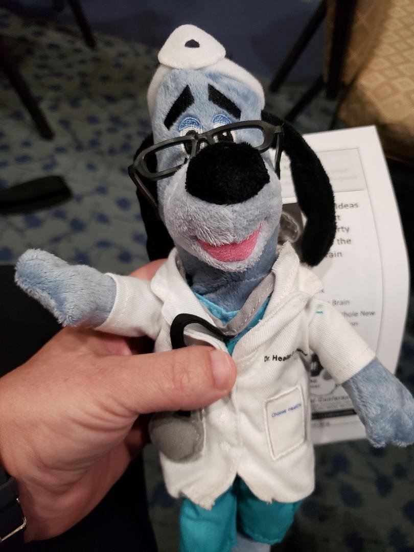 Theo is charming people. The UHC table gave him a stuffie.
