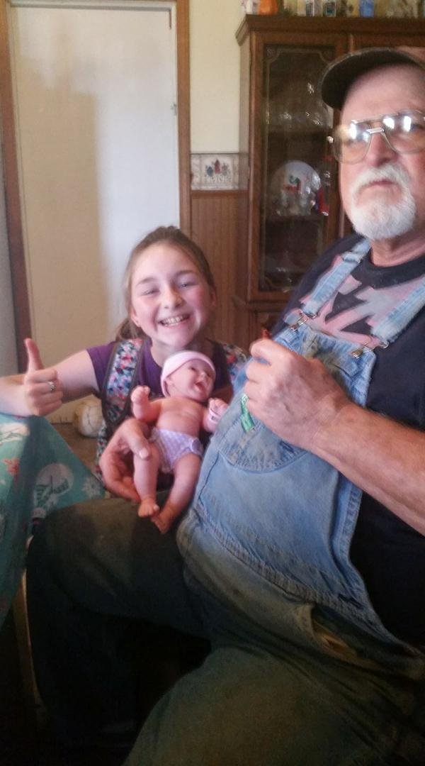 Great-grandpa holderING his great grandbaby