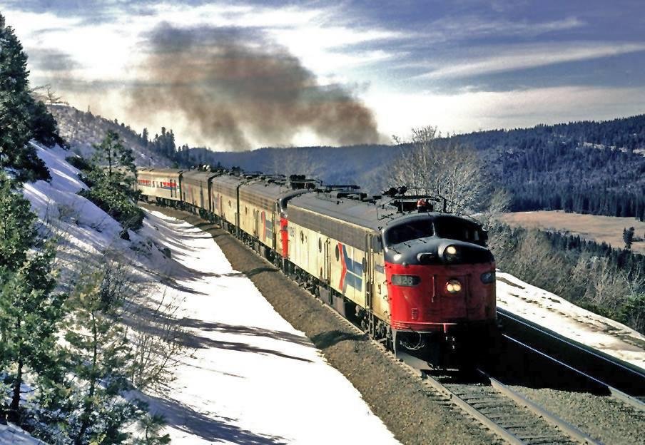 February 1974, Amtrak E-8 #326 has brought Train #6, the eastbound "San Francisco Zephyr", thru Emigrant Gap out onto Smart Ridge above the South Fork of the Yuba River. This unit was formerly UP #929A.