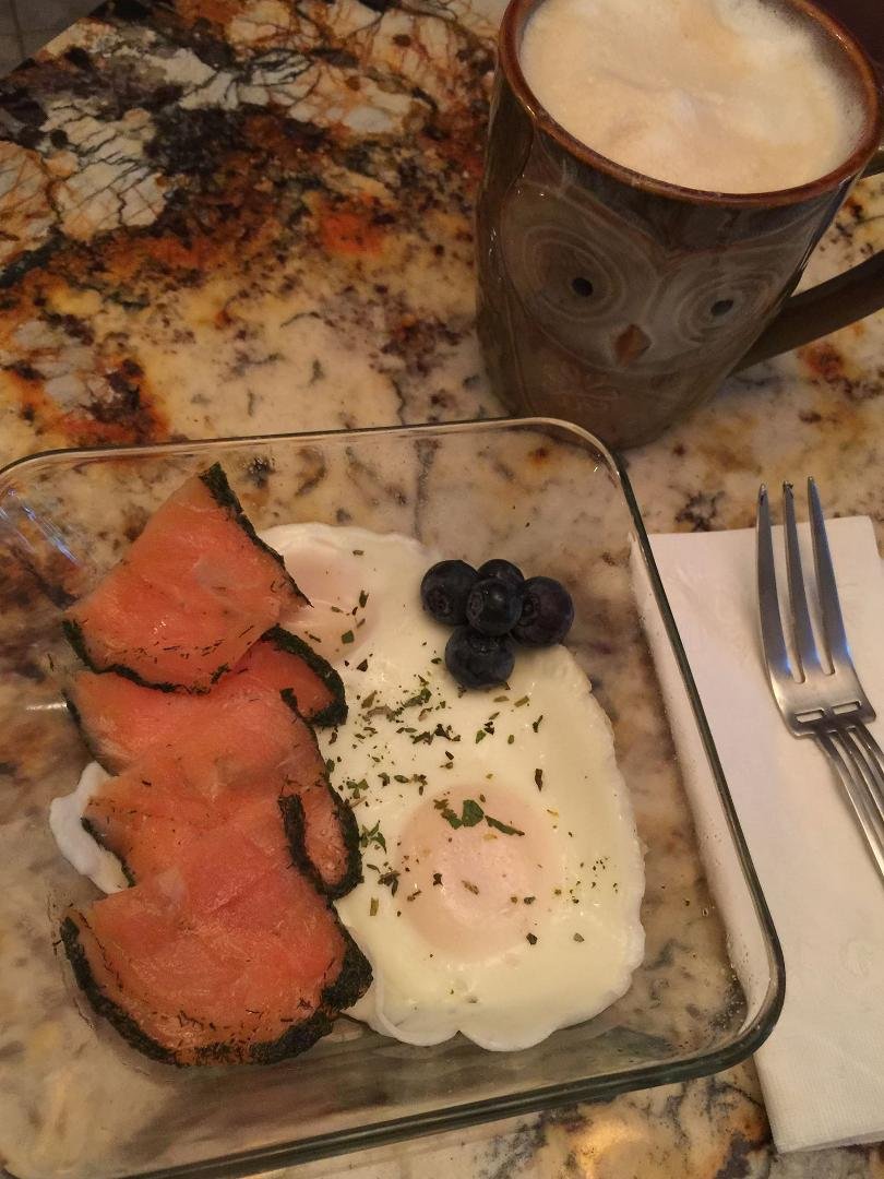 Today's breakfast: Two "froached" eggs, Peppercorn Smoked Salmon, garnished with fresh blueberries and paired with a French Roast Latte.