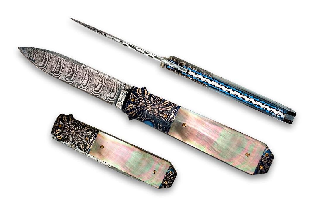 Just found this pic I had forgotten about, back when I was making folders.  It's the most expensive knife I ever made.  I think I got around $900-$1000 for it, probably worth twice that much. Damascus blade, hot salt blued 