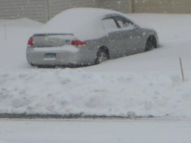 Eden Prairie snow plows buried this car in the driveway across the street...
Hopefully our plows will be here soon!!!!