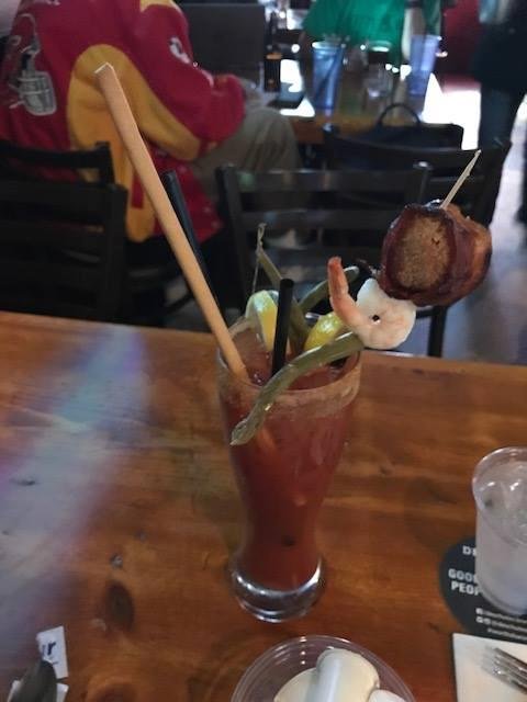 4 shots of pepper vodka, bread stick, shrimp, lime, lemon slices, fried cheese ball, bacon, asparagus, spices and oh Yeah some tomato juice.  22oz. of BREAKFAST in Bend, Oregon. Usually ridden with a nice IPA.