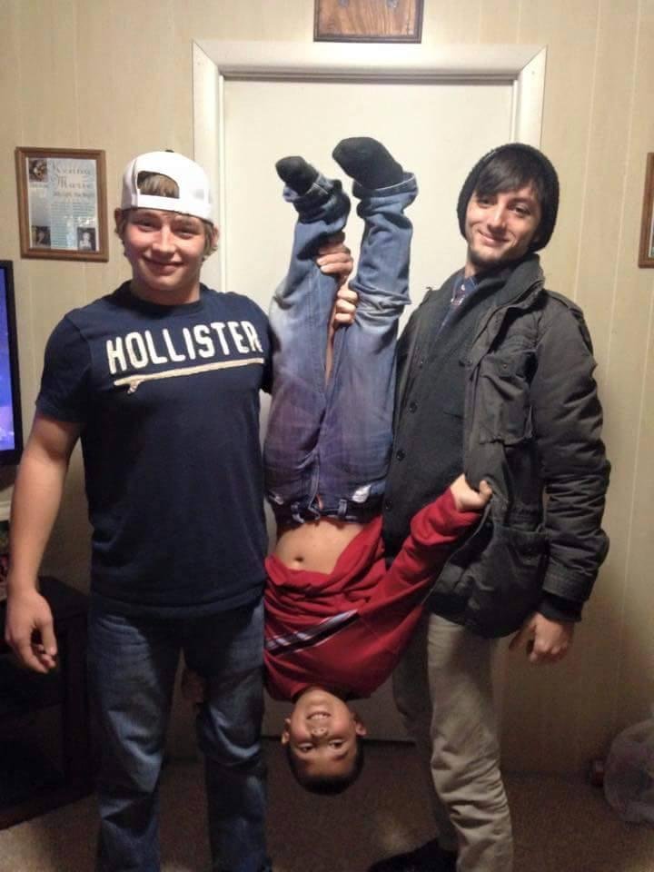 I love this photo. But why are the boys holding that boy upside down? KIDS THIS DAY?