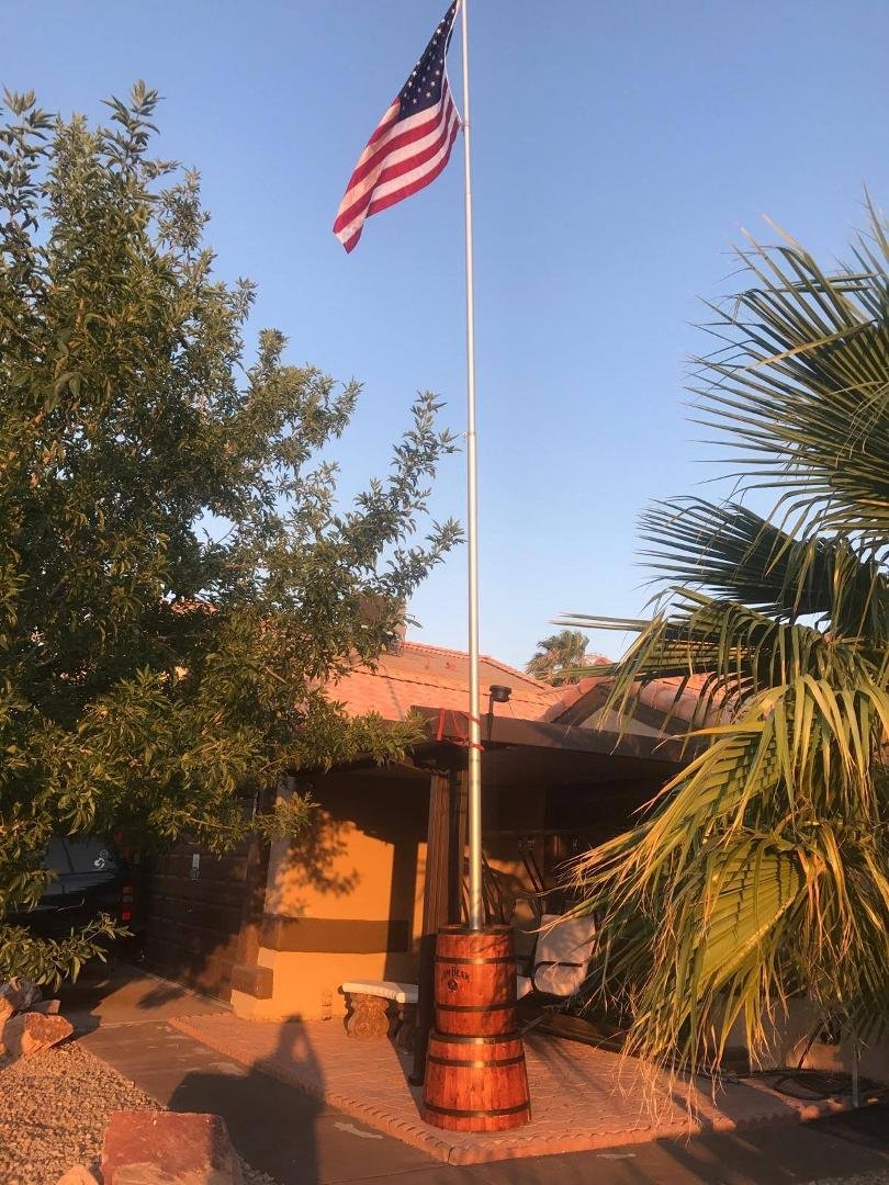 Ingenious Titan Flagpole installation in a Whiskey Barrel above ground
