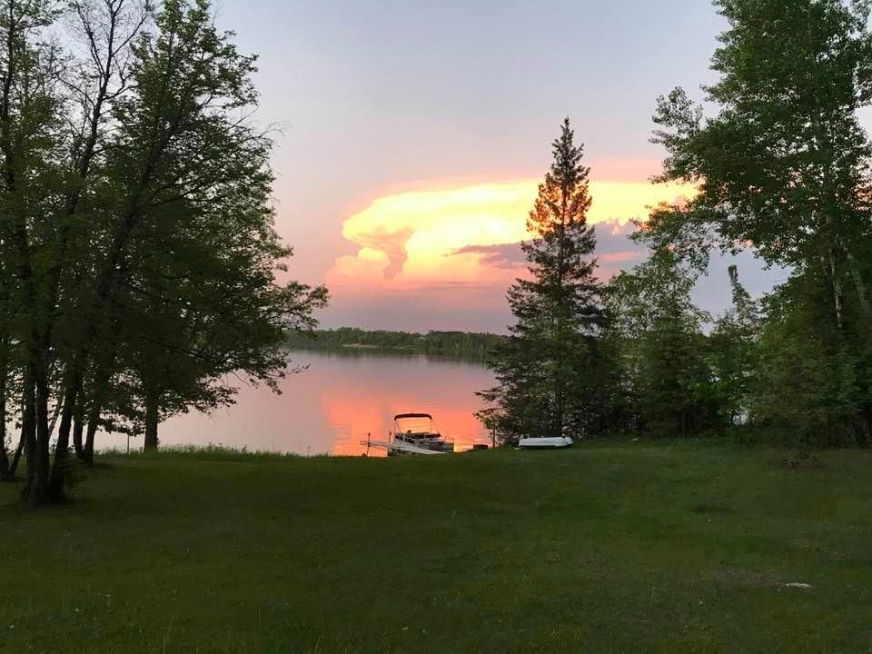 This is at the lake June 1st at 9:18PM the cloud was pink and the lake is so calm the pink is reflecting on the water. Love it.
