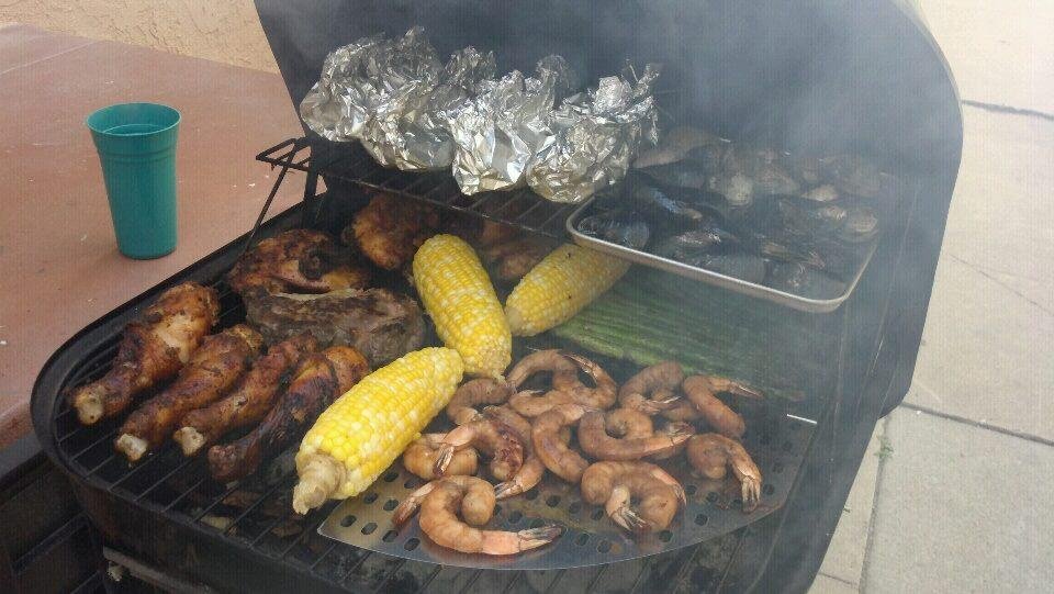 Grilling with the fam. If you look closely you'll see Jelani's Bison steak above the chicken legs. Salmon in the foil. I got a little something in the oven I call Anchor Trash..pics coming soon.