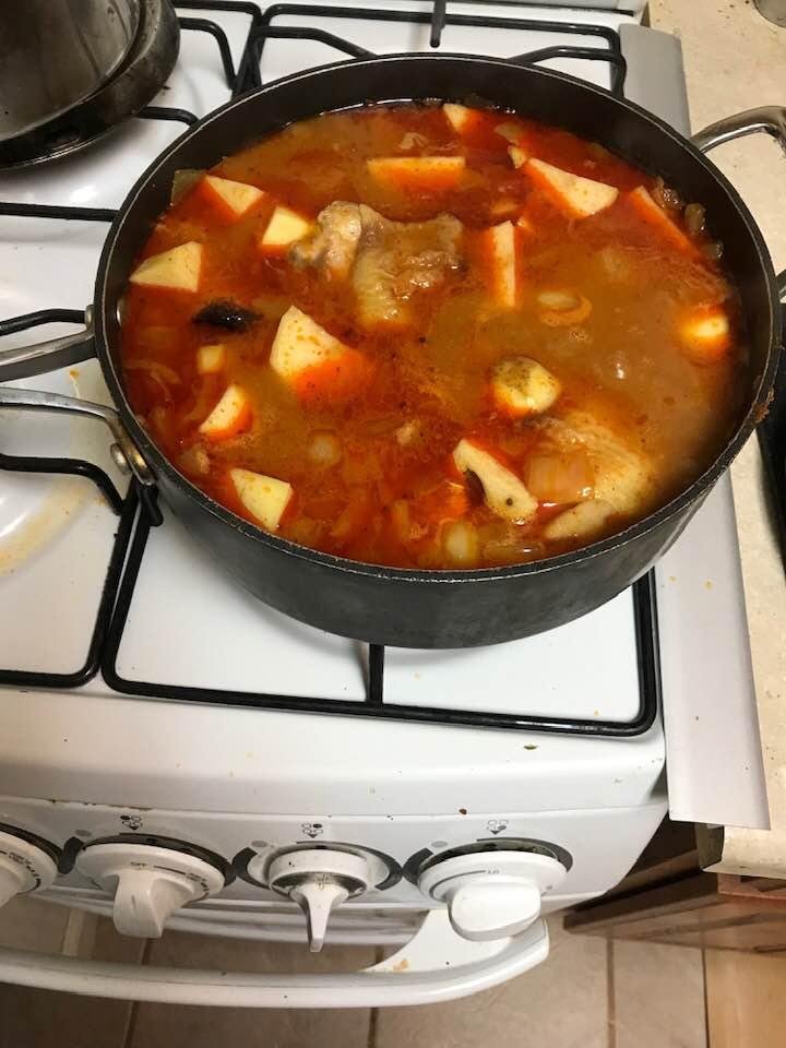 Chicken thighs in red curry sauce with potatoes just need to add coconut milk