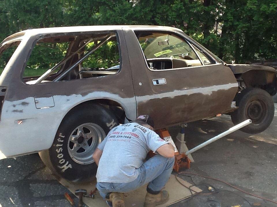 Cars at the body shop. Movin along