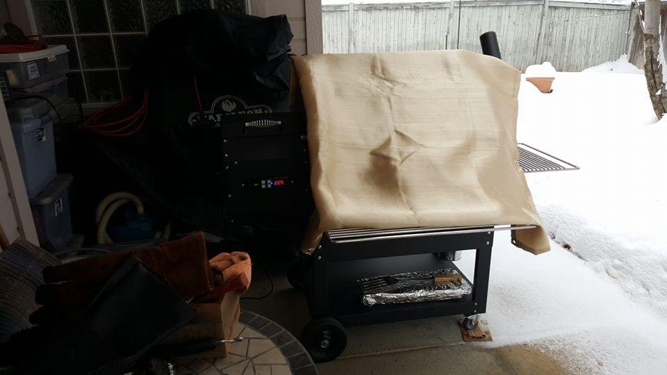 Tired of snow. Loaded the Yoder with brisket and pork butts. Put on a nice warm jacket on her to help her cook. Patience today is the name of the game. 😊