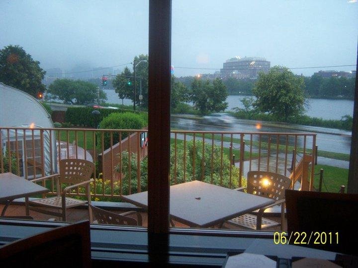 Looking at the Charles River from my dinner table inside the Hyatt Regency Hotel in Cambridge, on a rainy early evening. My steak and lobster dinner would arrive soon.