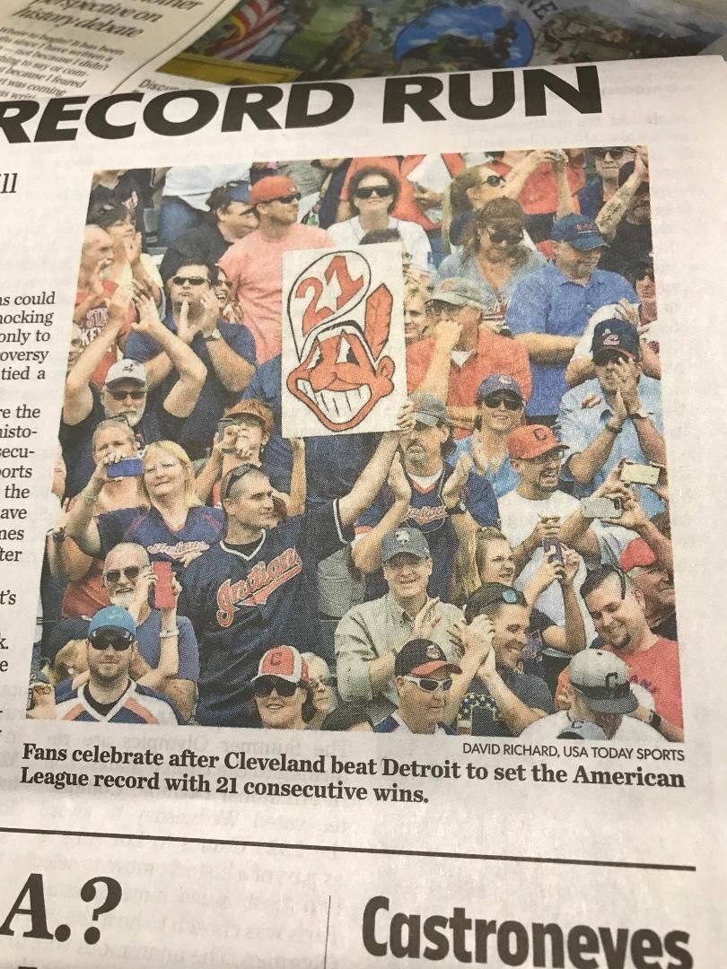 Michelle and John to the right of Chief Wahoo. This is in the USA Today yesterday.
