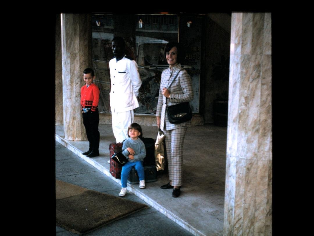 In front of the hotel in Salisbury, Rhodesia. James, Michelle and Suzy.