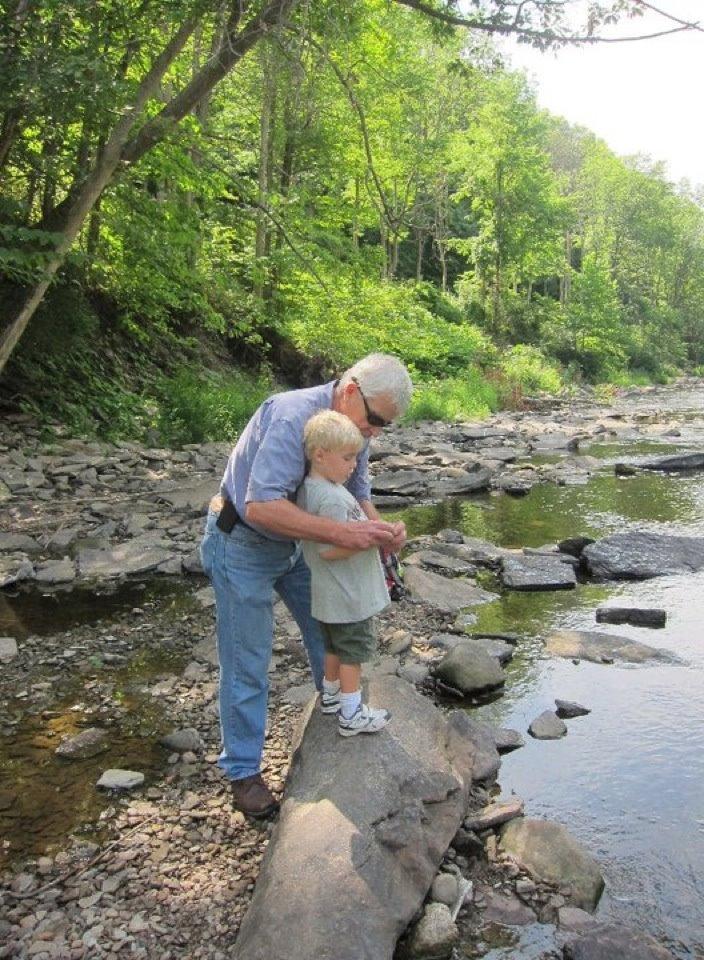 Aengus skipping stones on Pine Creek. Photo by Amanda