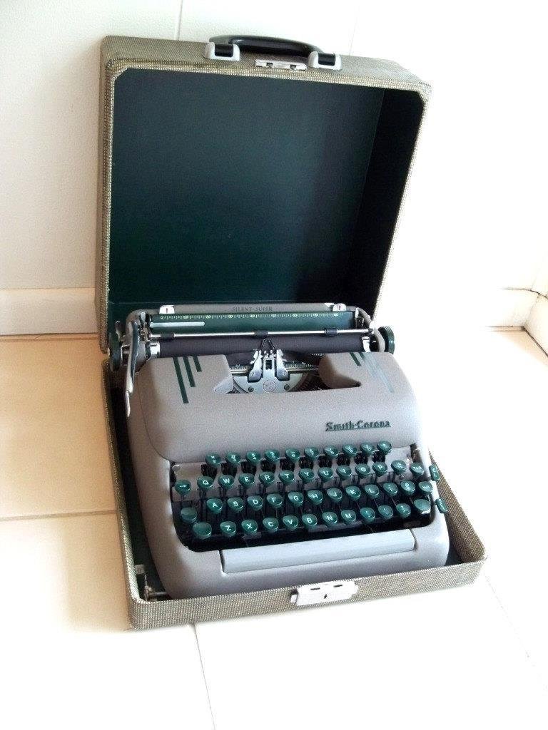 Identical to my mom's Smith-Corona "portable" typewriter (shown here in its travel case).