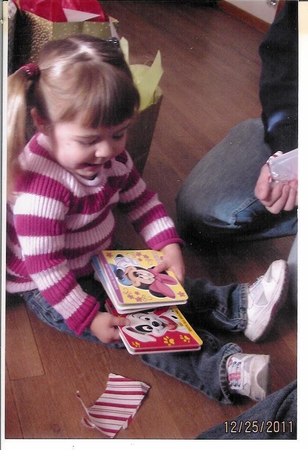 Avery checking out her new books.