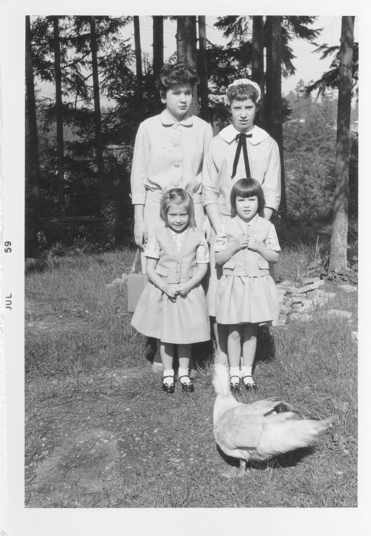 Easter 1959. Notice my big sister & I strategically placed the twins between us and our duck. We weren't stupid. Also, amazingly, my father managed to catch each of us in various states of something less than joy.