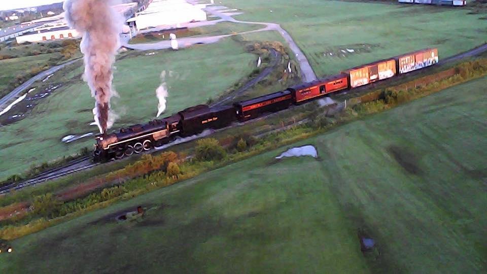Here is a photo captured from some video I took at the Flying Circuits field this morning. The field is located next to the railroad museum where "Ol' 765," a steam locomotive is kept.  It is on its way to pick up passenger