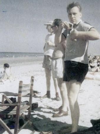 My brother, Dick Powers, enjoying the Carpenter & Powers, Inc. employee picnic, on Duxbury Beach. probably 1952+/-. I was there also. John MacDormand was the third person in the row.