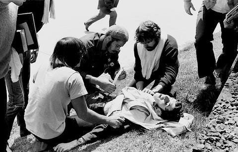 705/4-2 (27)... Wounded student John Cleary (see LIFE Magazine 1990) is attended to by (Dwane White), known as Brother Ibrahim, and _________ . ________ saved his life.