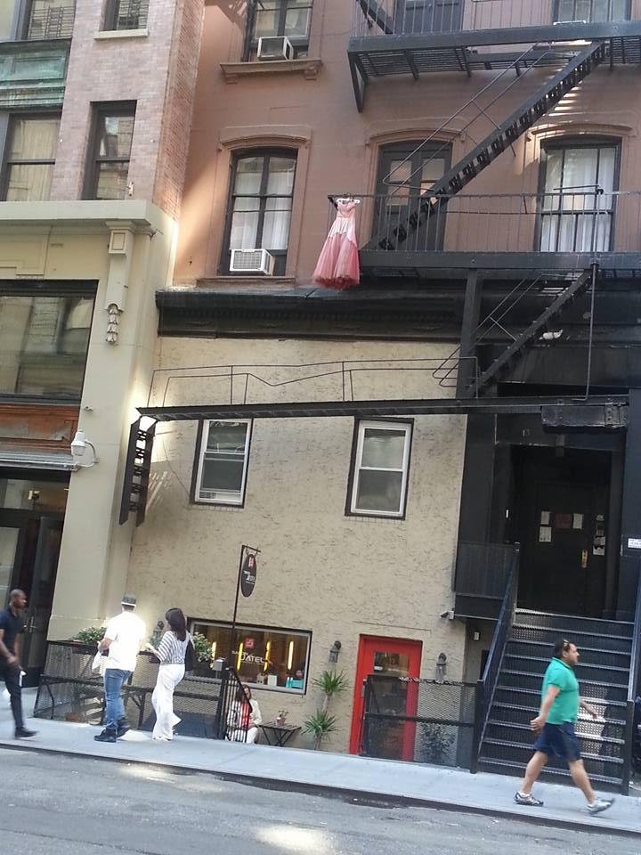 A slightly eccentric building on East 17th street in Manhattan.   That red dress is a mystery to me, too.