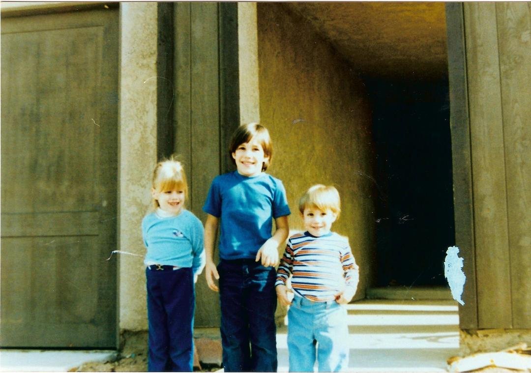 Tracy, Jamie and Kurt, and what looks like a ghost of some animal climbing up the post on the right. We had a lot of those over the years.