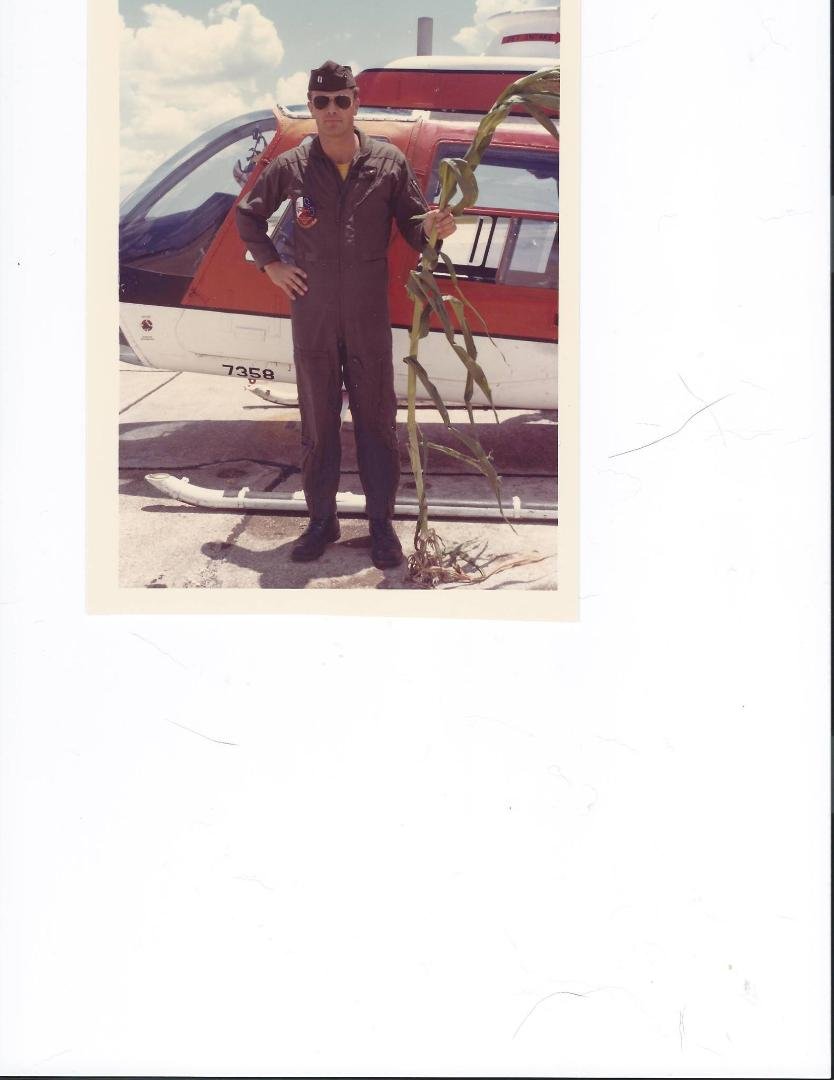 TBT fun.....a pic my buds took...after I "glided" a Jetranger into a cornfield...somewhere north of Spencer Field....a "few" years ago!! : )