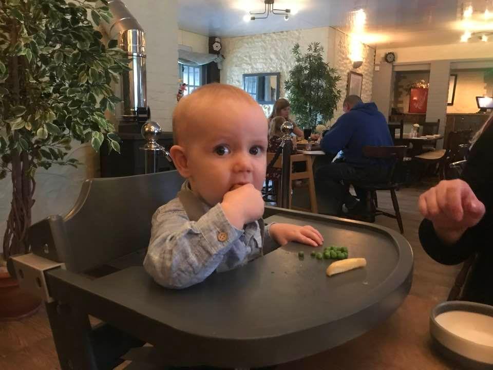 Andrew enjoying his dinner at the family meal in the restaurant.