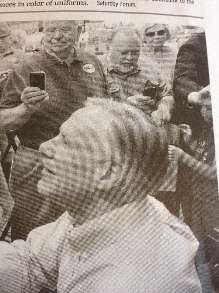 Hey. I made the Longview Snews. In background above the Governor.