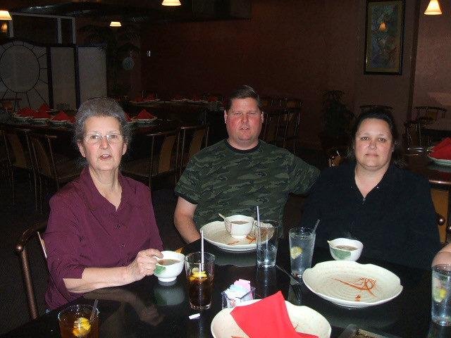 Linda Baker saying cheese along side our son-in-law Dade Russell and our daughter Tonya Baker Russell who seems to be a bit miffed at getting photographed