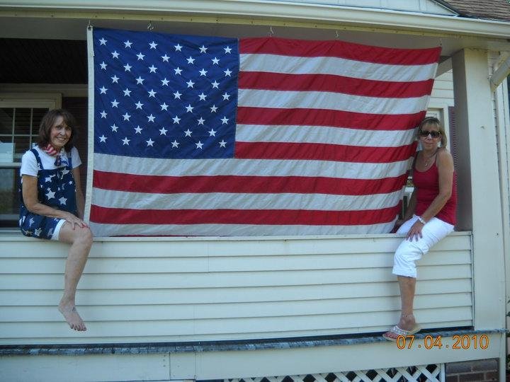July 4th - Not just a day to play but also a day to honor our country. Pam shows off her giant flag. Hey, we had a great time and I know Kim will be posting more pics of everyone and the fun we had. Thanks honey. Love y