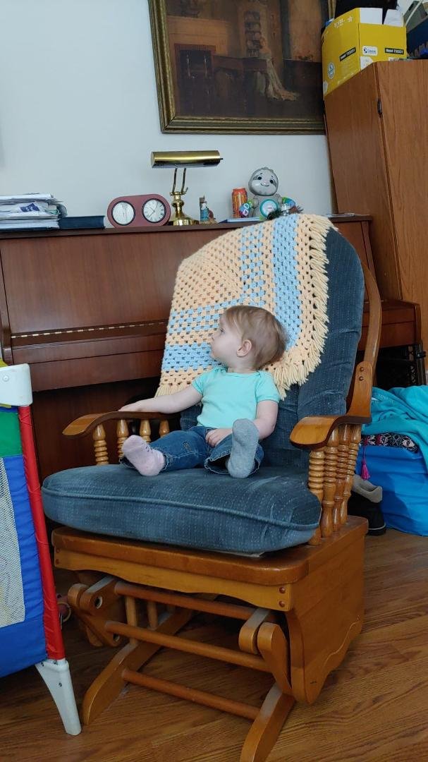 She sure loves her rocking chair.