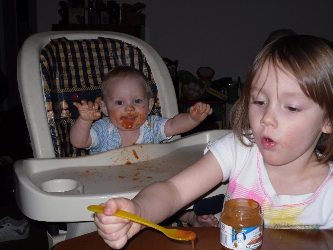 He loves it when his sister feeds him.