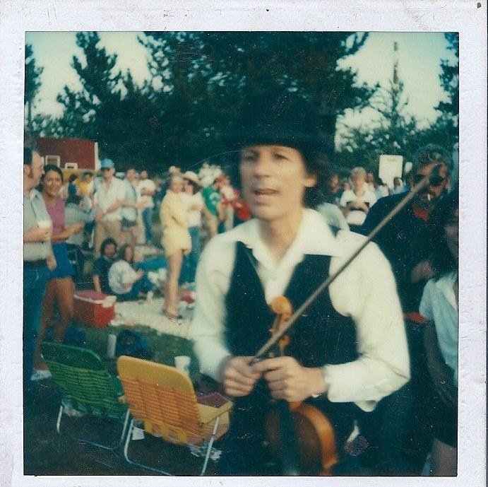 Cleaning my office tosday and I found this Polaroid of John Hartford at a bluegrass festival in Hillsboro Oregon in July 1980. He's out in the audience in the middle of his set, trying to clog dance in ankle high grass...O