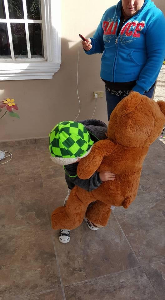 Louis trying to walk with the new bear on his feet ..lol