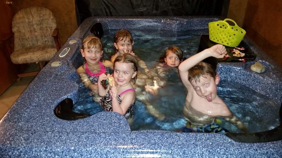 Grandkid pool party in our basement hot tub.