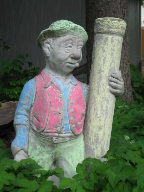 When worlds collide: idle hands, sidewalk chalk, and questionable taste in garden statuary.
