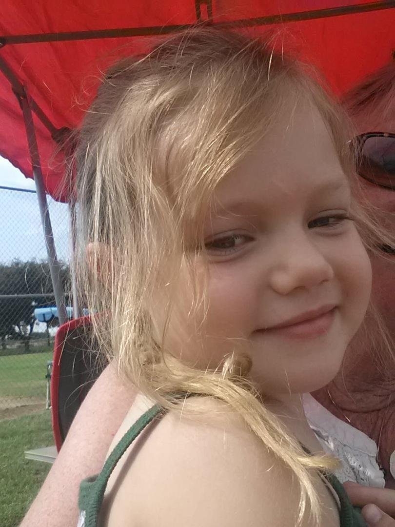 She is showing off her Frozen braid. She was so proud of it... Just love this face.