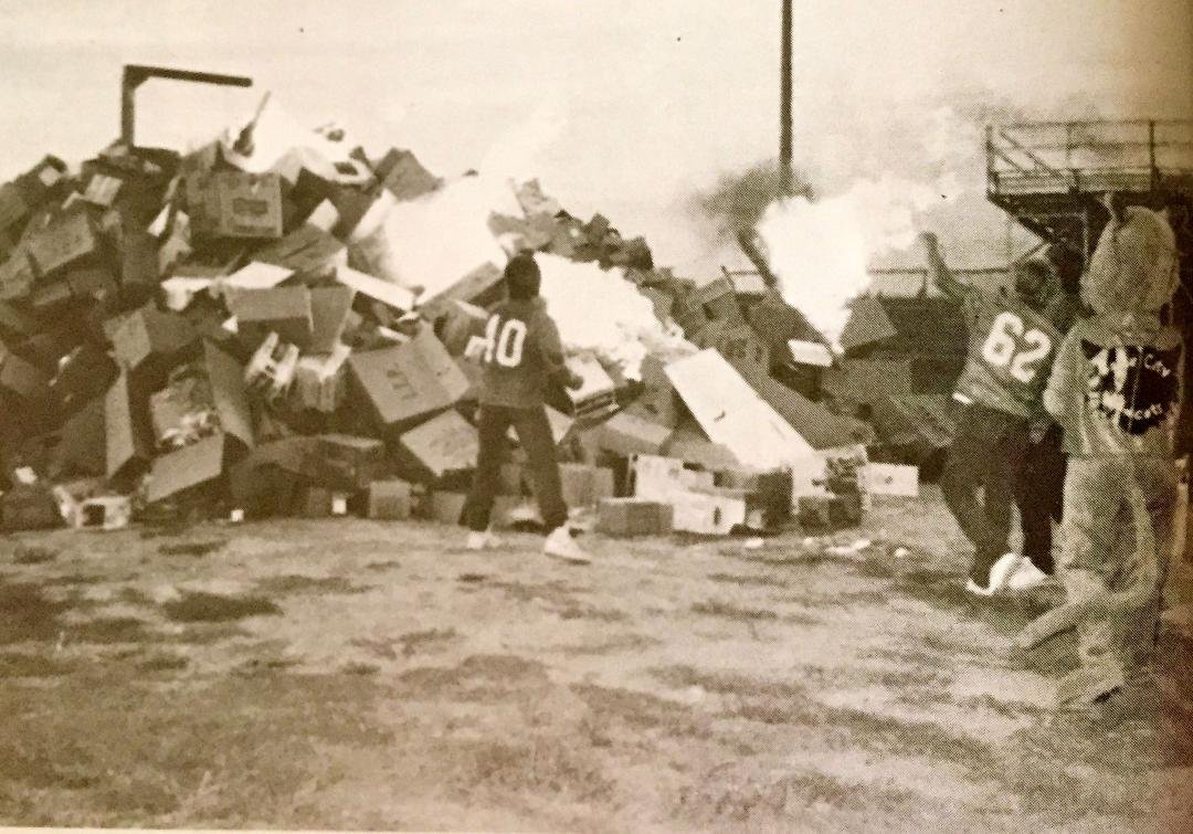 "Back in the Day" we would gather boxes all summer and create a giant mountain to burn at the bon fire. The seniors always got to light it by throwing a flaming torch! On top of the mountain of boxes was a Dummy on a sti