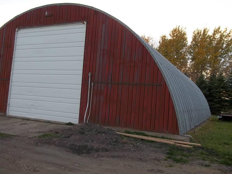 Have a heated shop in the Quonset, and can garage the tractor with all the attachments.