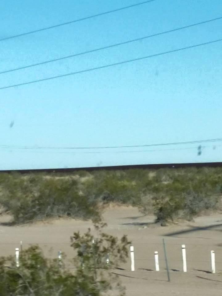 A view of the wall that separates California from Mexico on I-8...