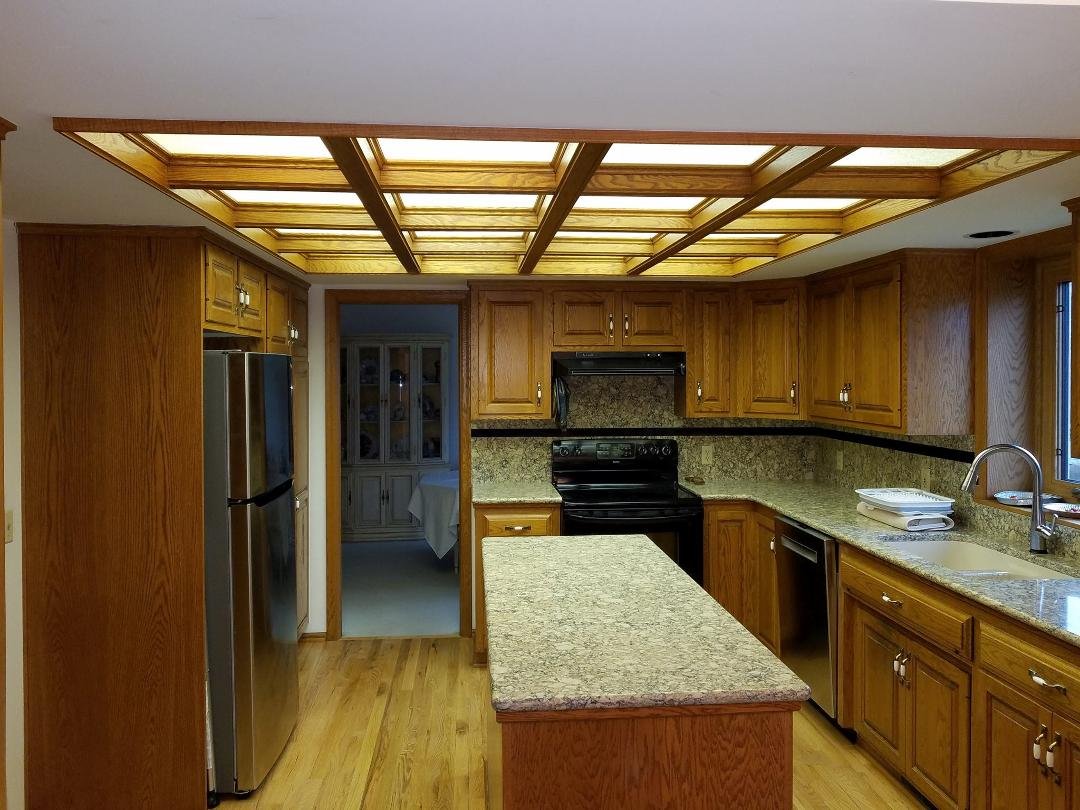 Some people remarked on our kitchen ceiling and weren't aware that it's actually a kitchen light consisting of a bank of fluorescent lights within a wood framwwork, each square covered by a lexan deflector. So, I decided to