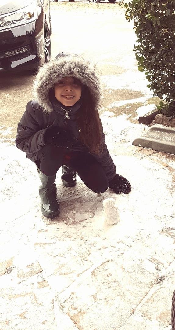 Yep..just enough snow to build a tiny snowman! She asked if we had raisins so she could use them for eyes.